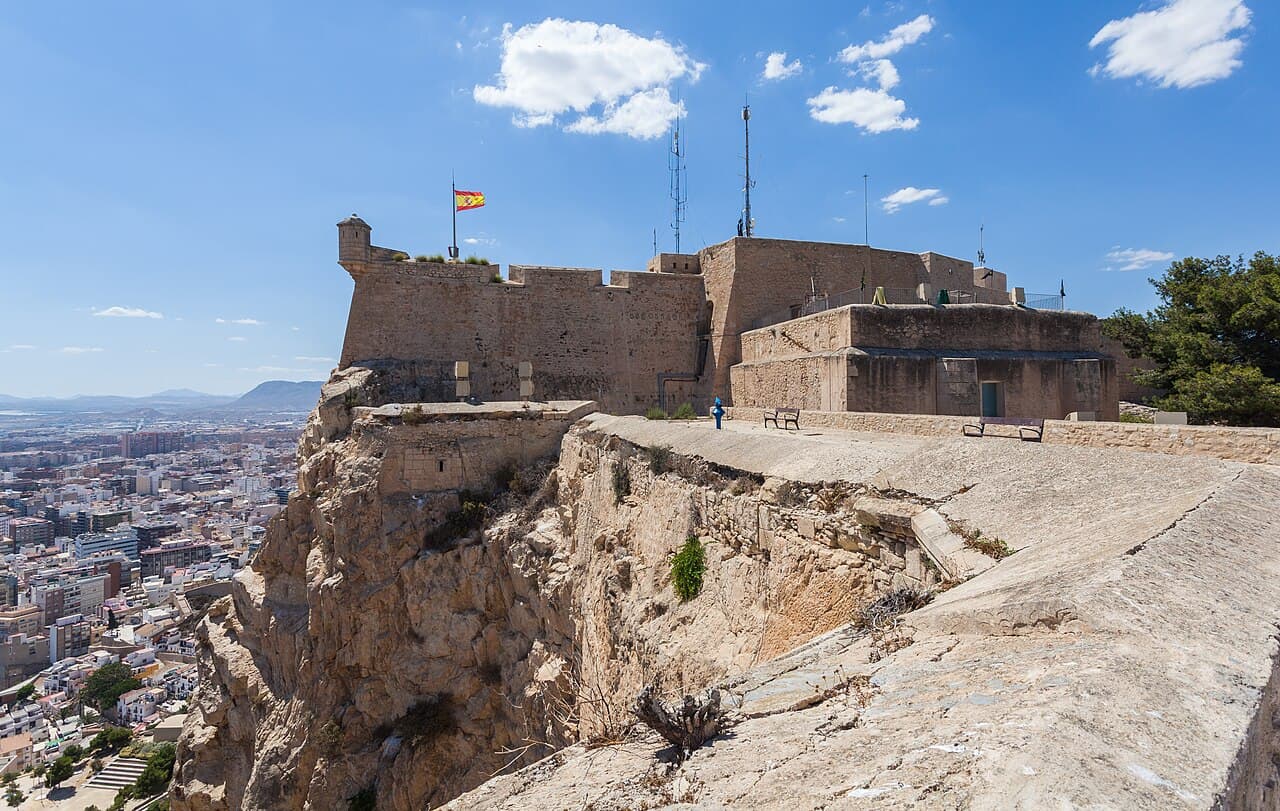 The walls of Santa Bárbara Castle on the cliff edge of Mount Benacantil