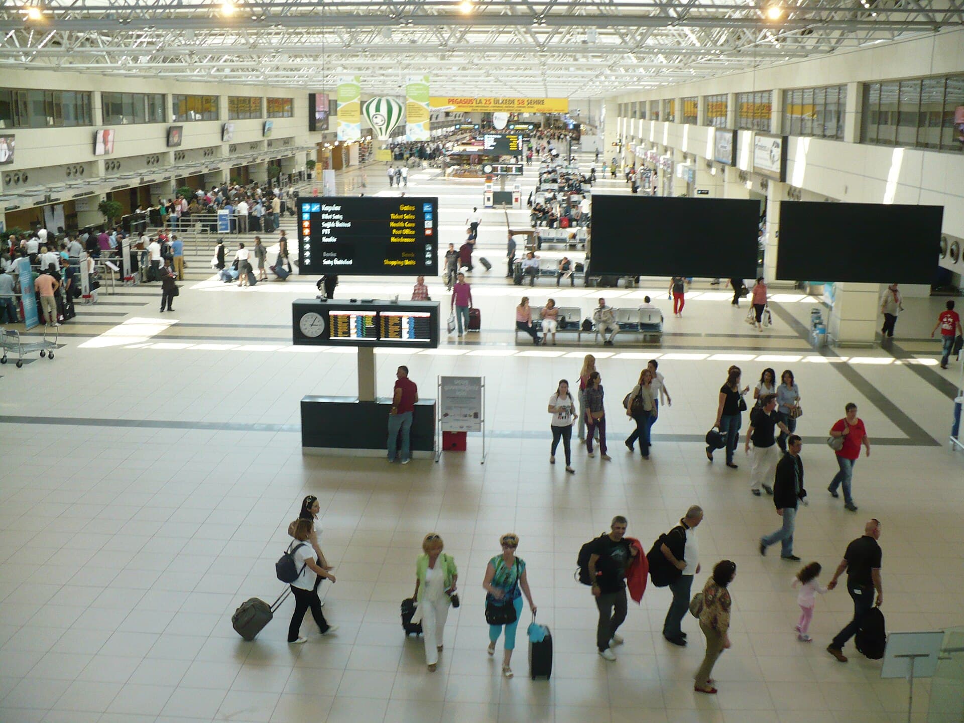 Travellers in a terminal hall at Antalya Airport