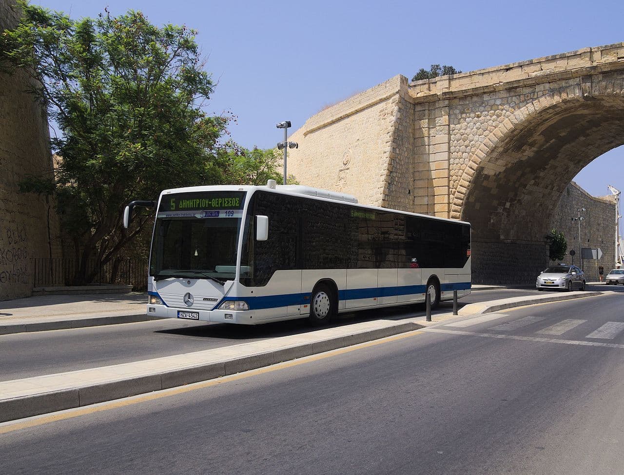 A Heraklion city bus beside the Venetian walls at Chanioporta