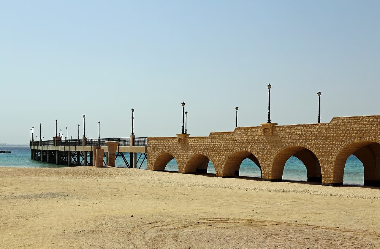 The arched stone walkway leading to the pier on the beach at Sahl Hasheesh