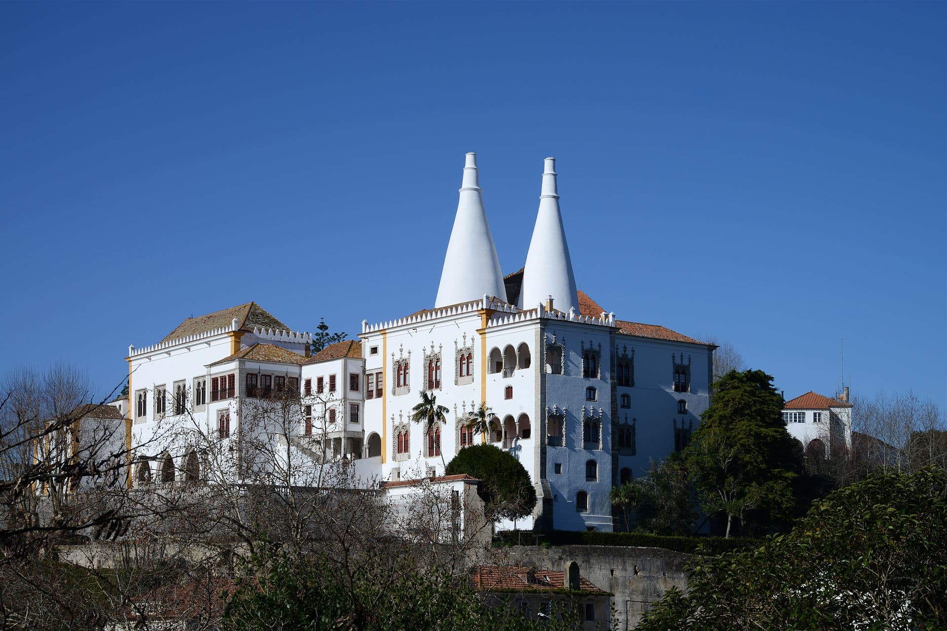 The conical chimneys of the National Palace of Sintra above the old town