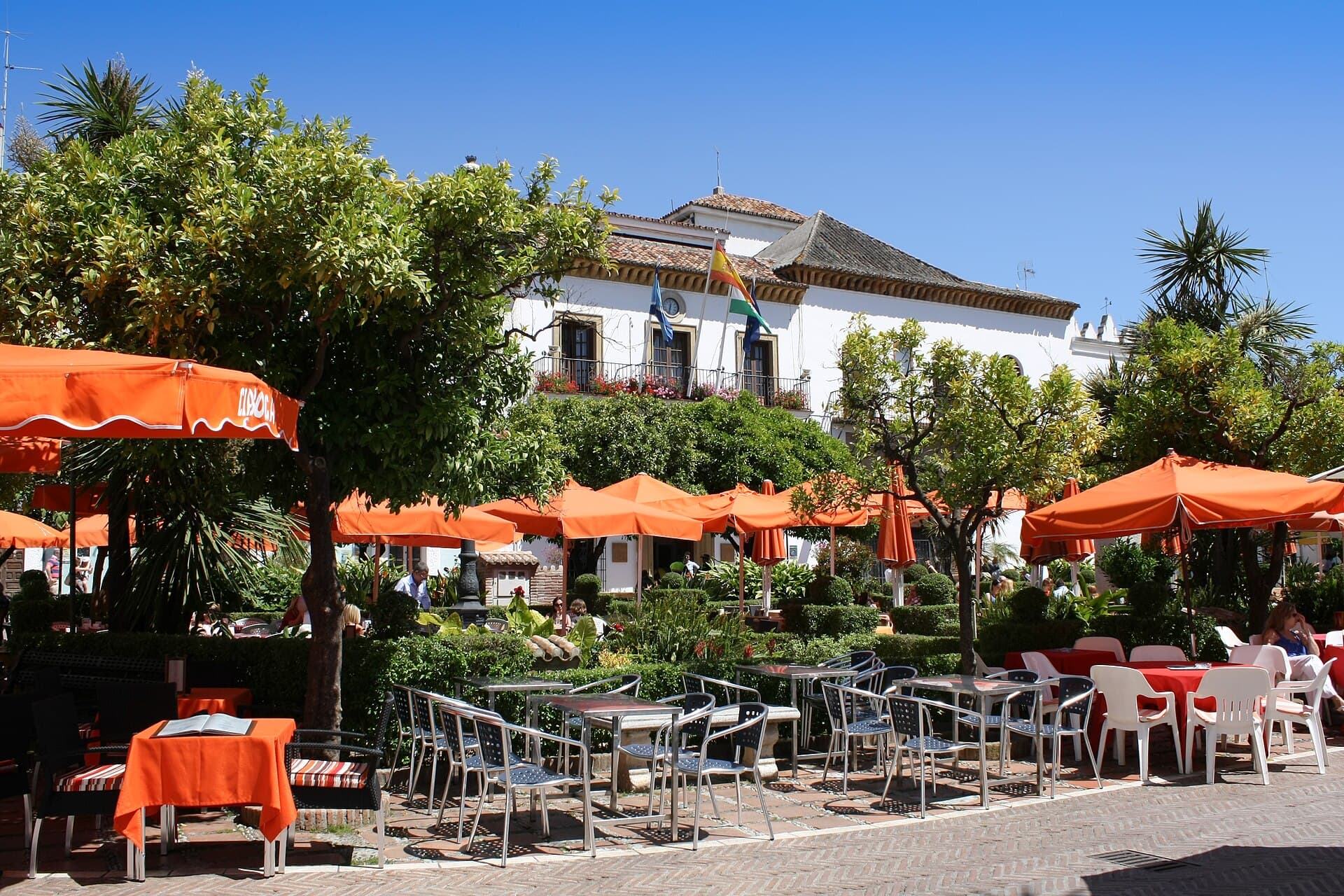 Café terraces under the trees on the Plaza de los Naranjos in Marbella’s old town