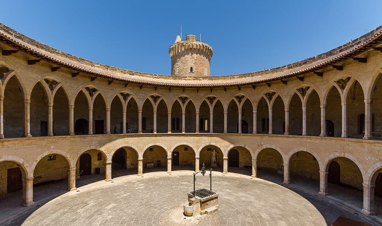 The circular arcaded courtyard of Bellver Castle with its well and tower