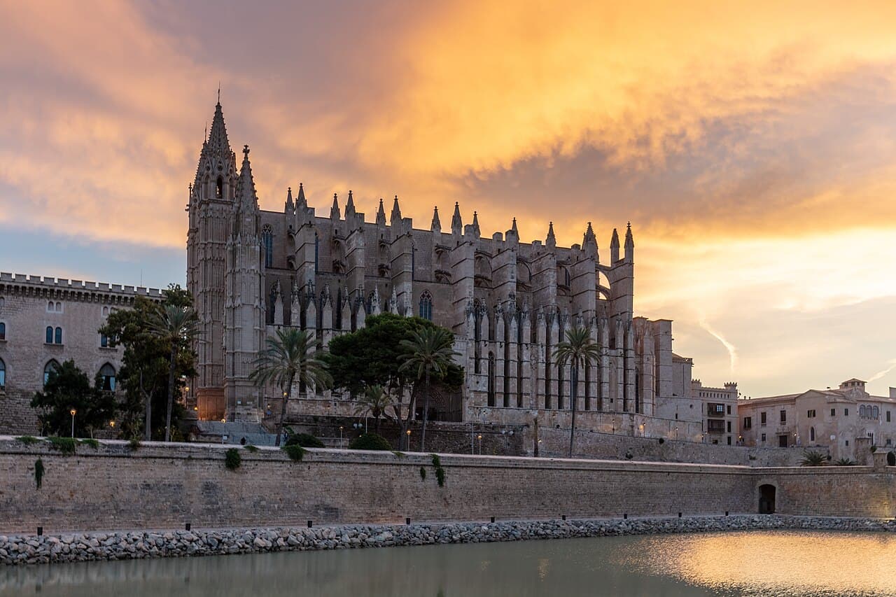 Palma Cathedral at sunset above the lake of the Parc de la Mar