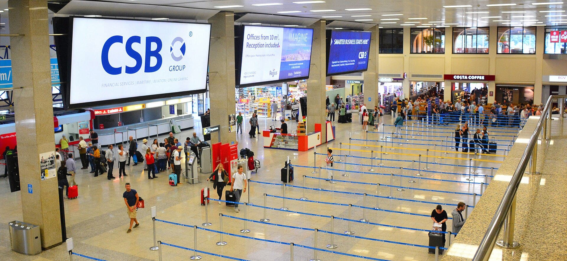 Passengers in the check-in hall at Malta International Airport