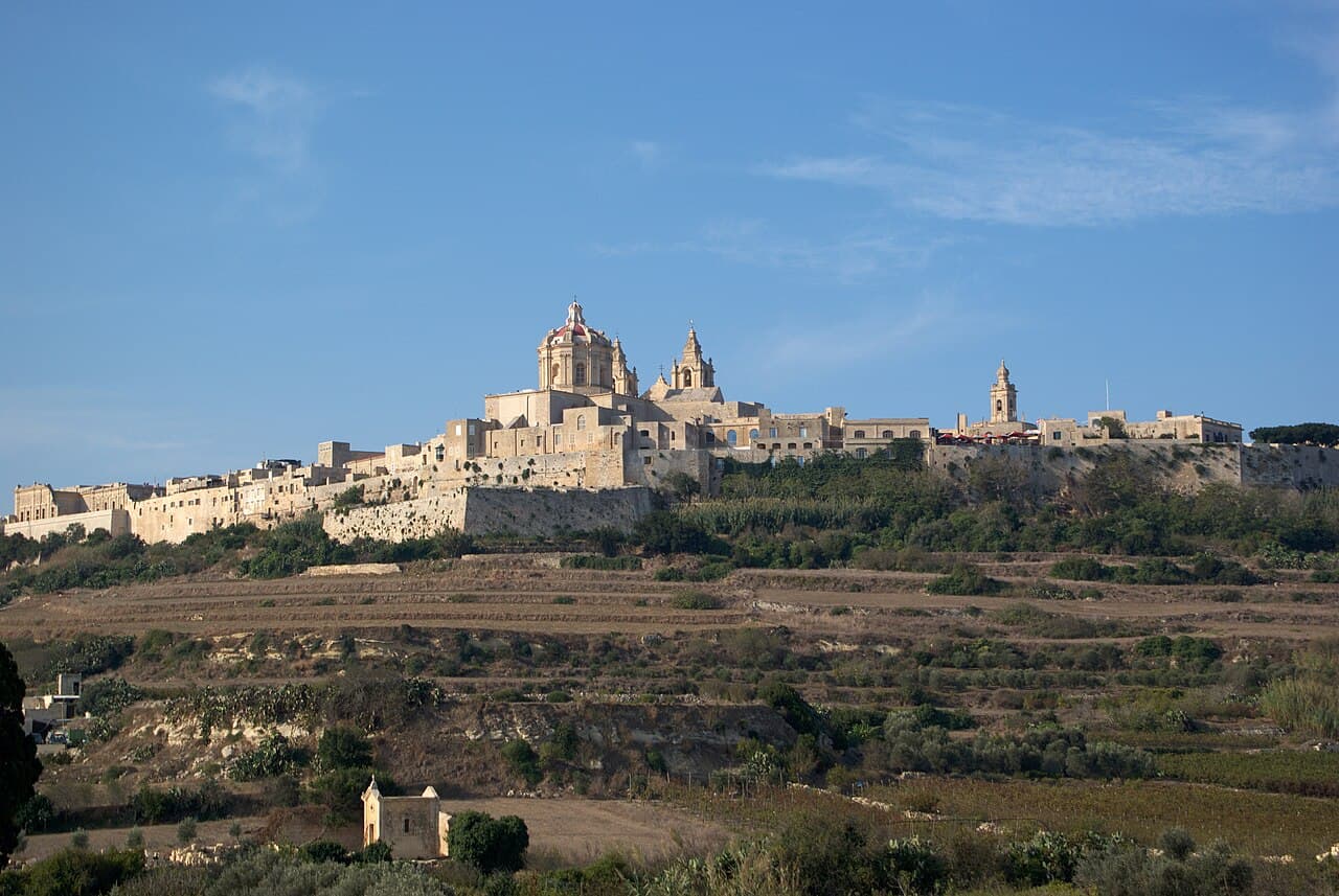 The walled city of Mdina on its plateau, seen across open country