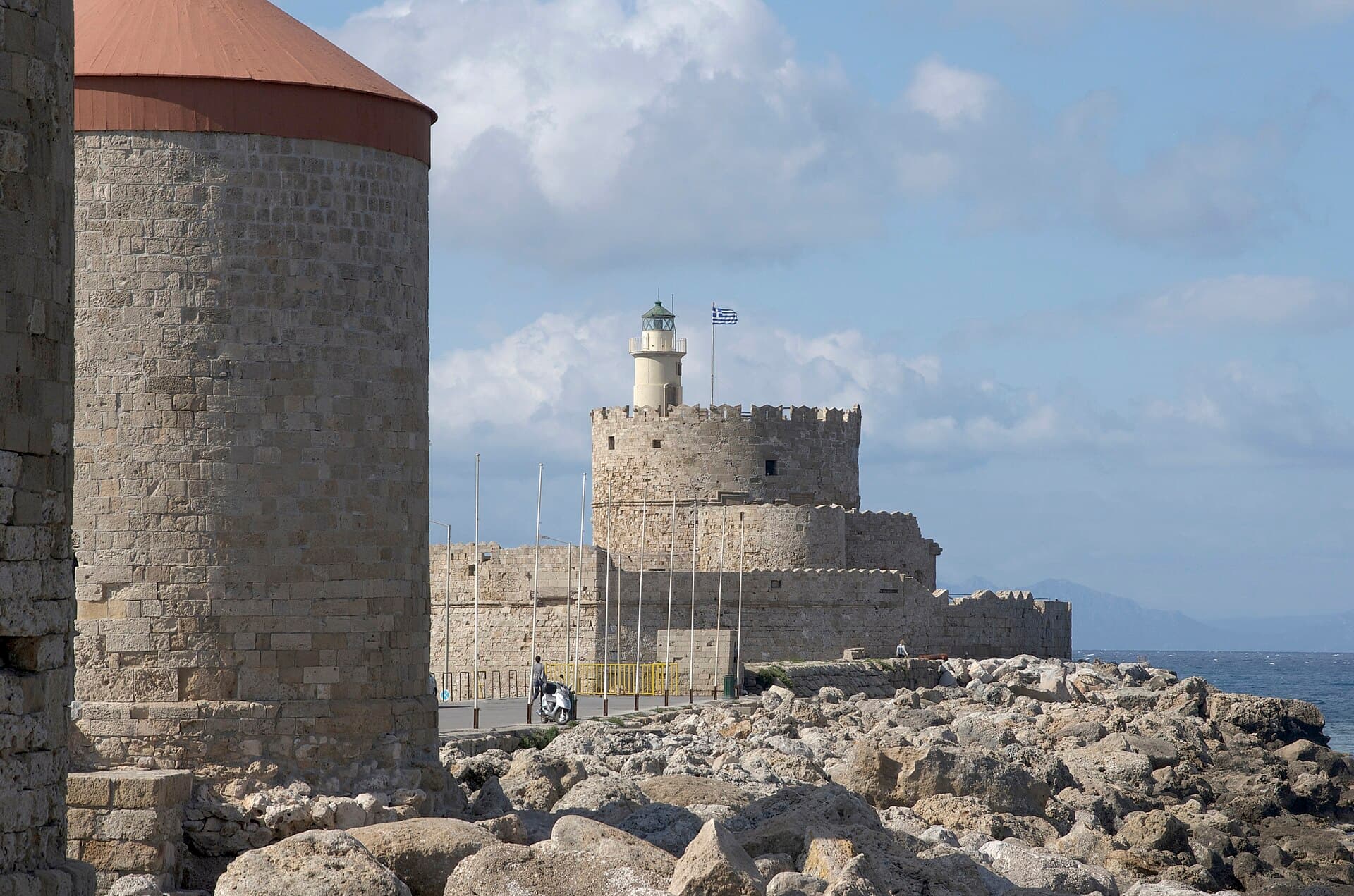 The Fort of St Nicholas and a stone windmill tower at the harbour of Rhodes Town