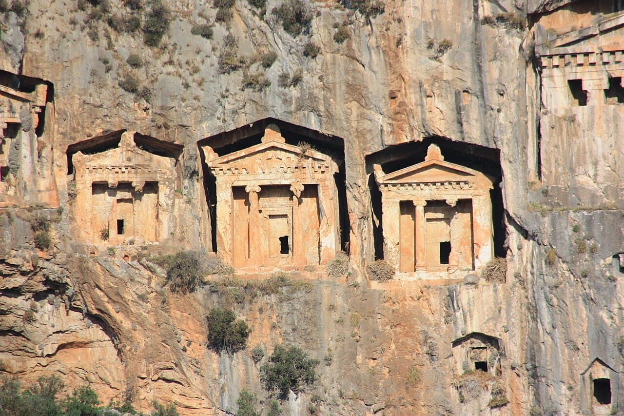 Temple-fronted Lycian rock tombs carved into the cliff face at Dalyan