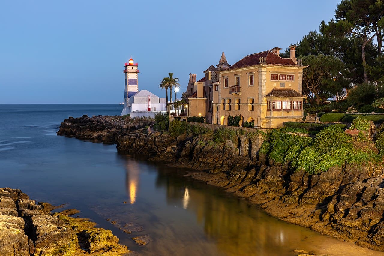 The Santa Marta lighthouse on the rocky shore at Cascais