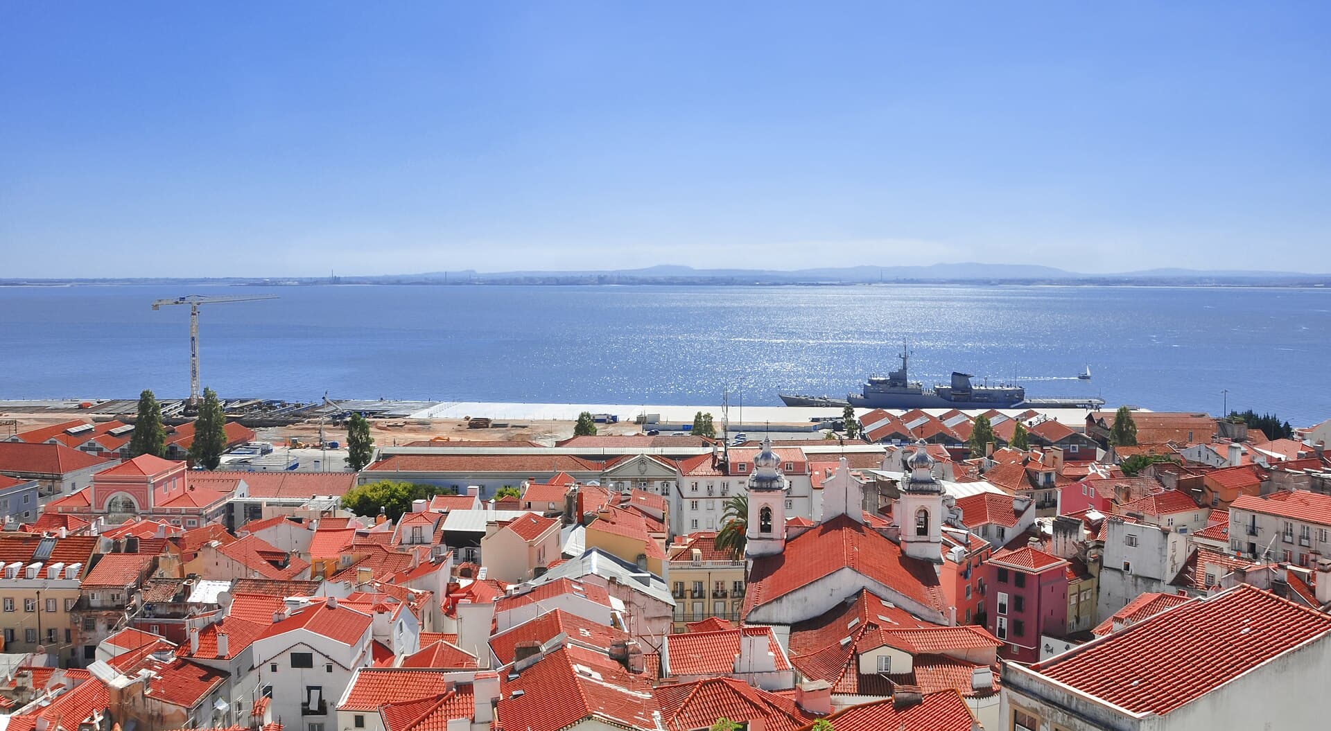 The rooftops of Alfama and the Tagus seen from the Miradouro de Santa Luzia in Lisbon