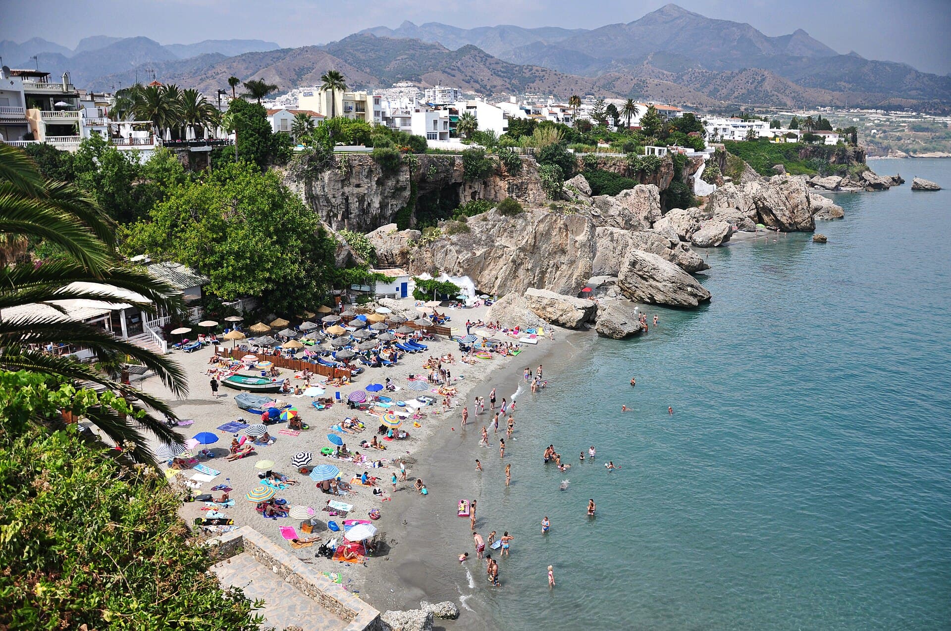 Calahonda beach below the cliffs of Nerja, with the mountains behind