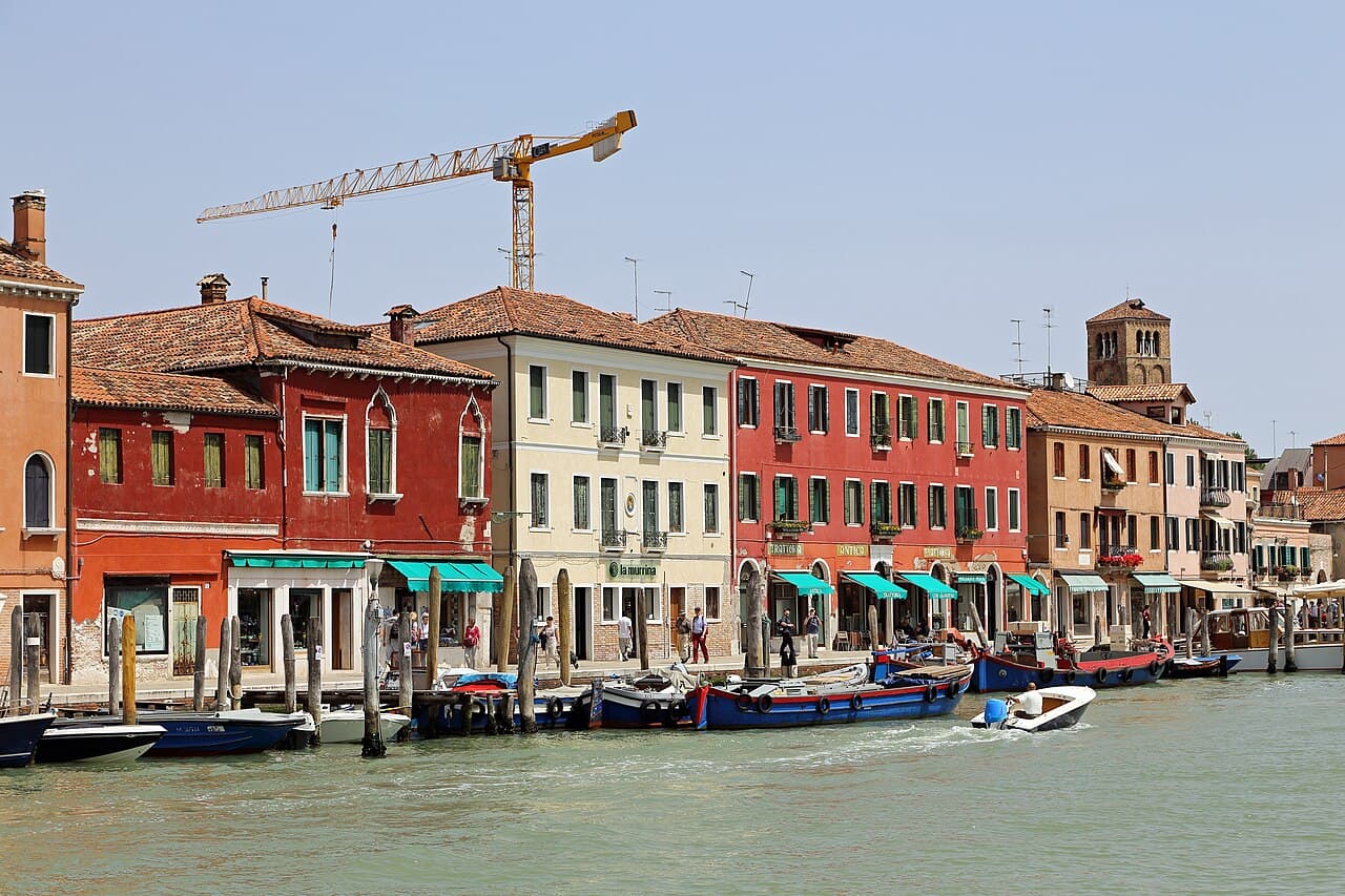 Houses and moored boats along the Riva Longa canal on Murano